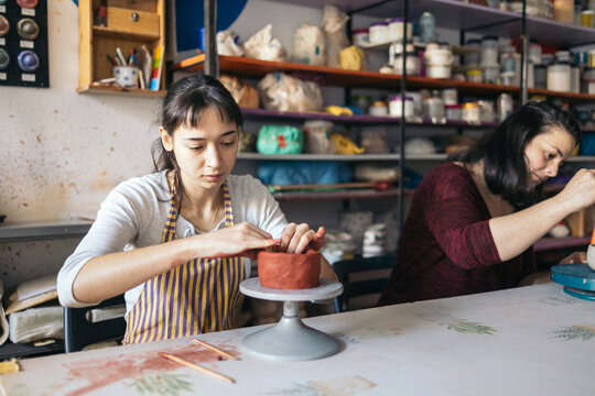 Women working in a pottery workshop