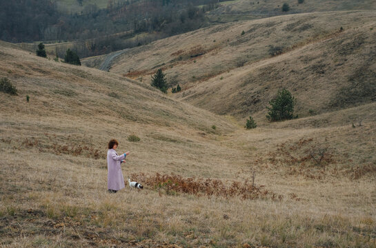 Woman And Her Dog in The Countryside