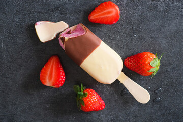 strawberry and ice cream in black and white chocolate