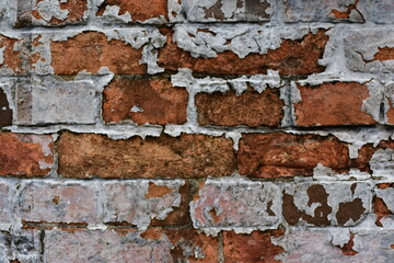 brick wall with peeling paint