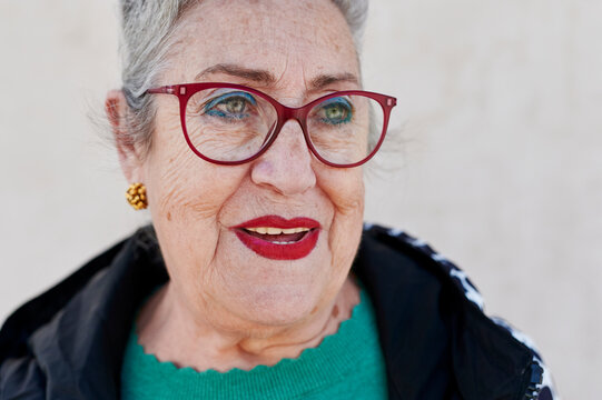 Smiling Senior Woman Standing Outdoors