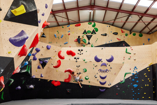 Male athlete climbing wall