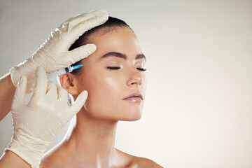 Dermatology, woman or injection for plastic surgery, beauty or filler with gloves on studio...