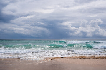 Fototapeta na wymiar breaking wave at pambula beach