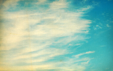 Vintage background in the blue sky with clouds