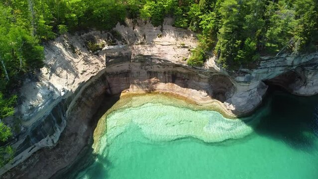 Eroded Rock Cliff with Sea Cave Aerial Pan, Pictured Rocks National Lakeshore
