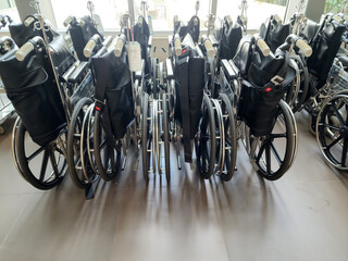 Several wheelchairs for the elderly and disabled in the hospital