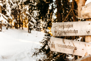 signs to the mountain station Rosenalmbahn and Fichtenschloss in the ski resort Zell am Ziller in Tyrol, Austria