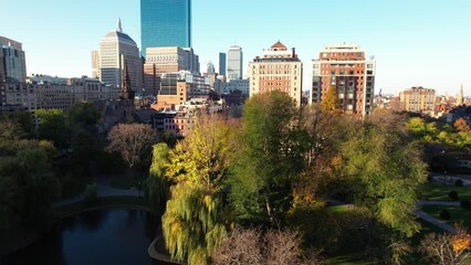 Boston Public Garden in downtown, aerial rising above city landscape on cold winter morning