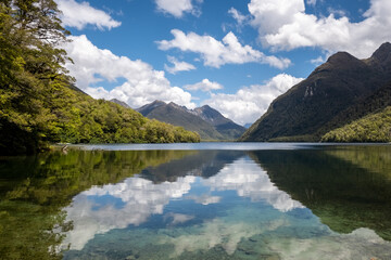 David Peaks reflected in the calm waters of Lake Gunn in the South Island of New Zealand