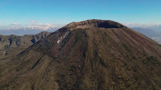 Aerial view rising to Mt Vesuvius summit, sunny South Italy hiking landscape
