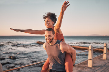 Sunset, relax and couple piggyback by ocean enjoying holiday, vacation and quality time on weekend....