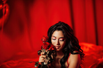 Portrait of smile sexy asian girl glam makeup in lingerie with red roses and coupe glass champagne