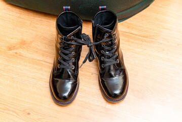 April fools day concept.A shoe tied together at home in the living room.