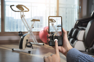 A woman who takes a picture and registers it on an app to sell her goods second-hand