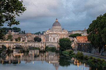 Beautiful colorful morning view of Rome Skyline with the famous Vatican Saint Peter Basilica and Saint Angelo Bridge above Tiber River in Rome, Italy.