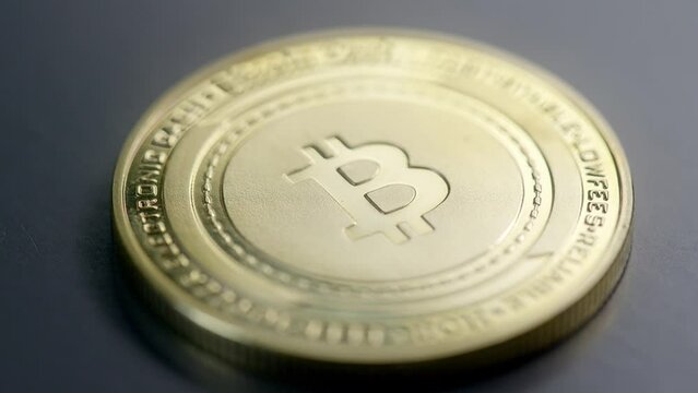 Super close-up detail shot of bitcoin cash golden coin; zoom in and out