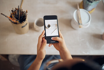 Phone, pottery and hands take photo on screen for social media, blogging and creative website for...
