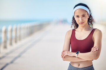 Fitness, portrait and woman with arms crossed at beach promenade for exercise, wellness and mockup in Miami. Female sports athlete standing at seaside outdoor for workout, summer training and running - obrazy, fototapety, plakaty