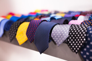 ties on hangers in men clothing store