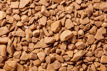 Instant coffee granules, bunch in bulk close-up macro top view