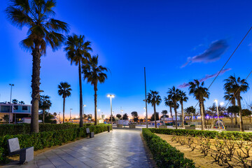 Beautiful promenade at Playa de las Arenas beach in Valencia at dawn, Spain.