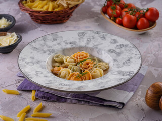 Penne pasta in tomato sauce with chicken, tomatoes garnished with parsley on a wooden background
Photo Formats