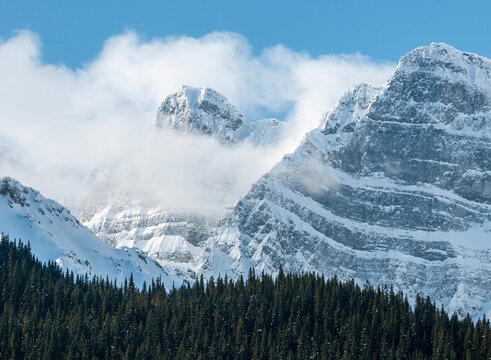 Clouds and mountains rising above Chephren Lake in Banff National Park, Saskatchewan Crossing, Alberta, Canada.