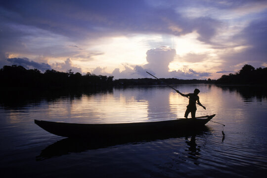 Warao Indian fishing at dusk in the Orinoco delta, Orinoco River, Venezuela, South America