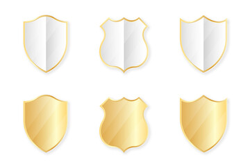 Gold shields collection. Golden badges and labels in shield shape. Protection and security concept design element. Vector