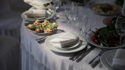 Elegant Table Setting: A Perfectly Presented Table with Glassware and Delicious Dishes