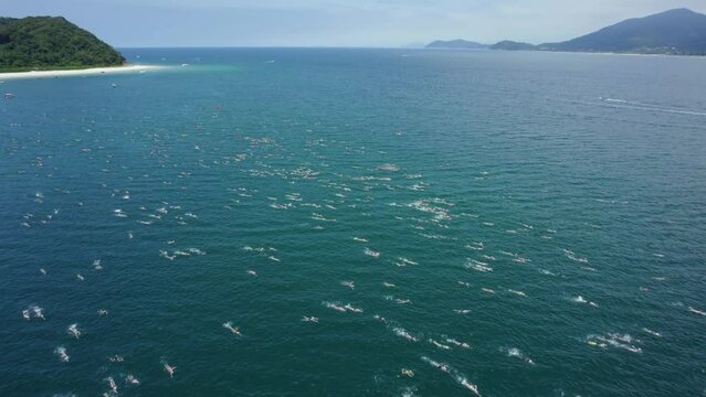 Aerial view over the Travessia da Fuga das Ilhas swimming race, in sunny Brazil
