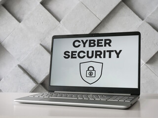 Cyber security is shown using the text on the screen of laptop