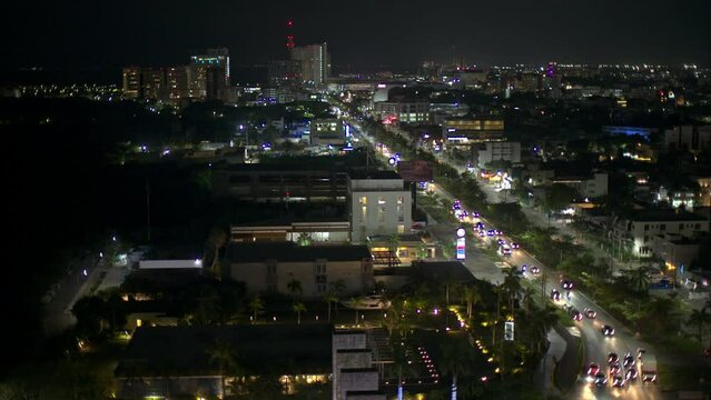 Aerial view of Cancun city at night with cars driving by on Av. Bonampak