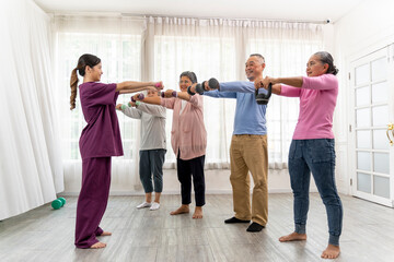 Group of senior peoples enjoy to exercise together in nursing home