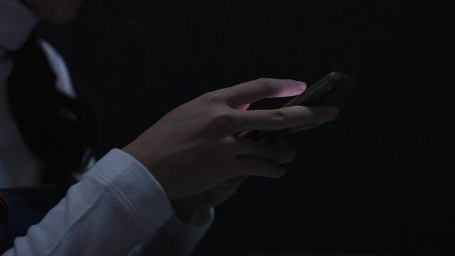 Close-up Hand of woman using smartphone searching information, sending email or text message, playing social media.