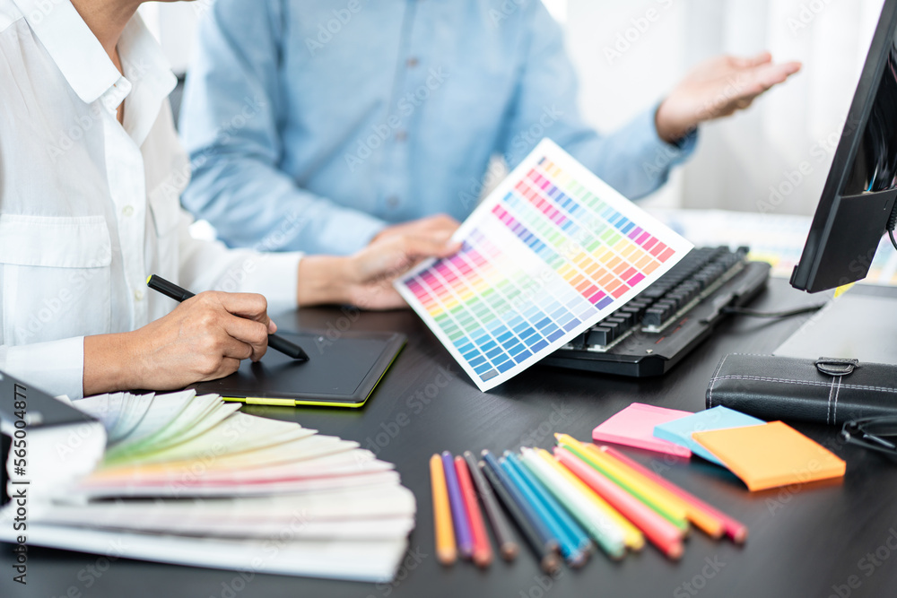 Aufkleber Team of creative graphic designer working on color swatch samples chart for selection coloring in inspiration to create new collection at workplace
