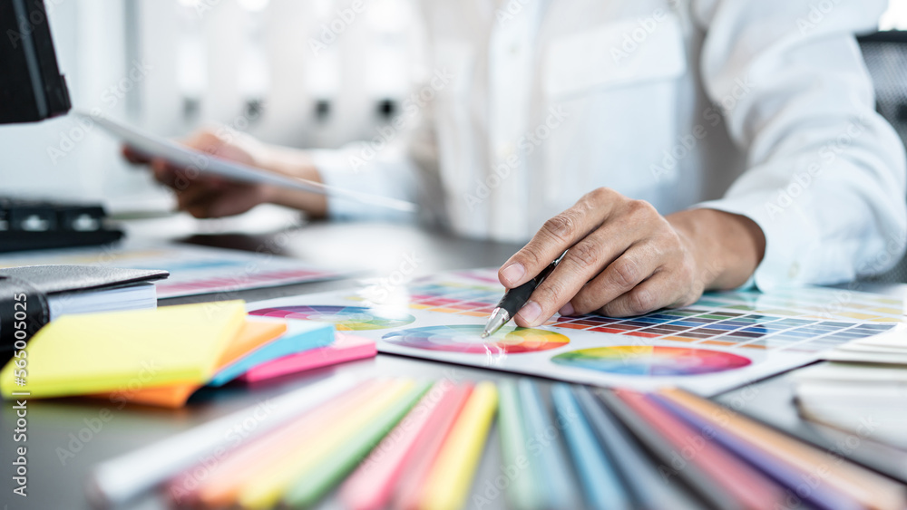 Poster young creative graphic designer working on color selection and d