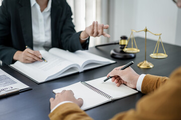 Businesswoman and Male lawyer or judge consult and conference having team meeting with client at law firm in office, Law and Legal services concept