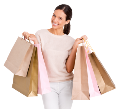 Portrait of an attractive young woman posing and holding up shopping bags isolated on a PNG background.