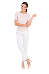 A casually dressed beautiful young woman posing and standing with one arm crossed and looking at...