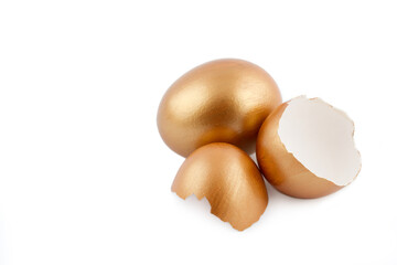 Easter concept. Golden egg with empty broken golden eggs isolated on white background