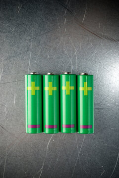 Overhead view of green batteries on table