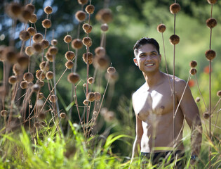 Honolulu, Hawaii - young man running at Diamond Head overlooking the highrises of Waikiki.
