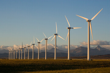 Windmills used for power generation at sunrise, near Pincher Creek, Alberta, Canada.