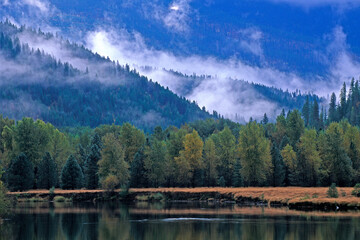 Morning fog separates mountain layers above the St. Regis River.