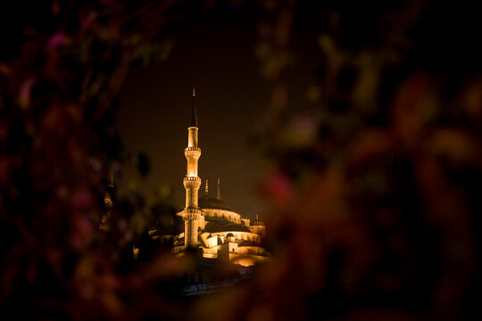 The Sultan Ahmed Mosque or Blue Mosque rises into the night in Istanbul, Turkey.