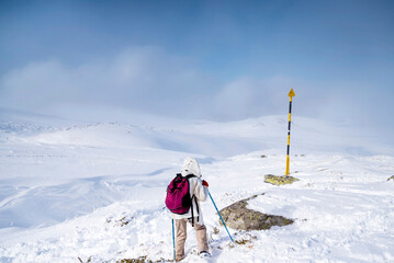 Woman  Hiking in the High Snowy Winter Mountain .Vitosha Mountain ,Bulgaria 