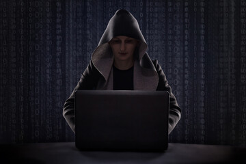 masked hacker using smartphone. Hacking the Internet.