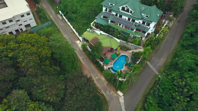 Mahe Seychelles drone shot of residential area and touristic accommodation, a small village on Mahe Island in the north coast